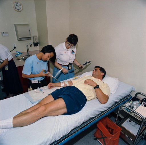 STS-58 crewmembers participate in baseline data collection