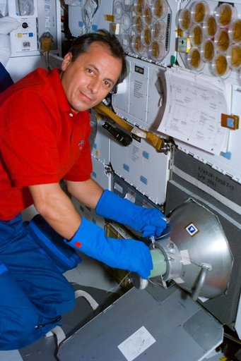 BRIC-12,Mission Specialist Tognini handles the GN2 freezer.