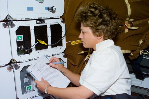 CCM-C,Collins checks the middeck experiment