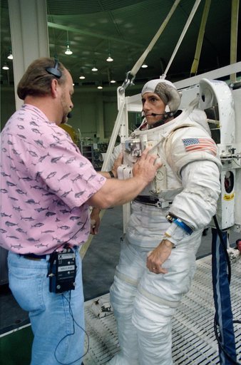STS-65 Mission Specialist Thomas in EMU prepares for WETF contingency EVA