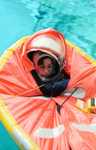 Astronaut Ellen Ochoa in small life raft during training