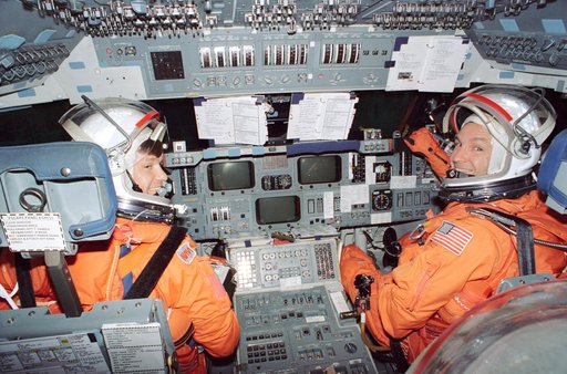 Astronauts McMonagle and Brown on flight deck mockup during training