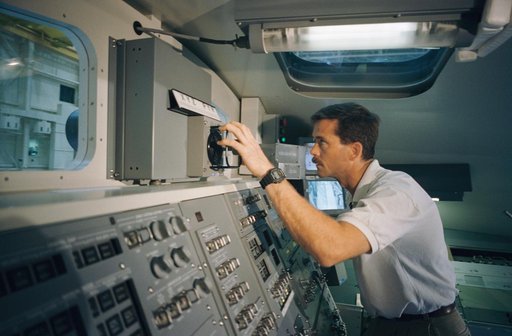 Astronaut Chris Hadfield practies with Shuttle RMS controls in MDF
