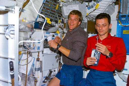 Various views of the STS-95 crew on the Discovery's middeck