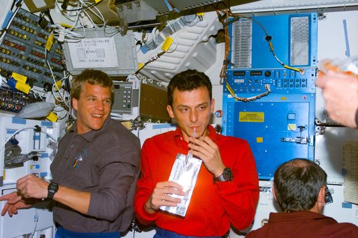 Various views of the STS-95 crew on the Discovery's middeck