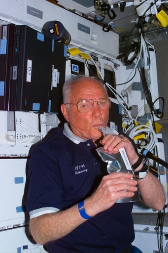 Glenn on middeck with drink package