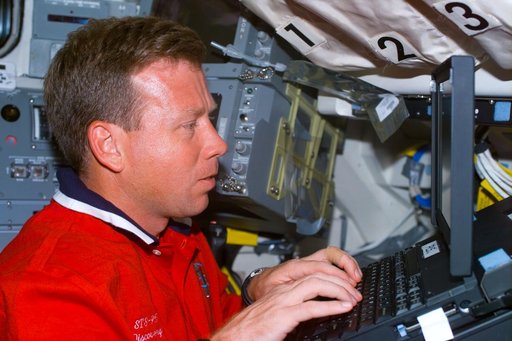 Lindsey with laptop on flight deck