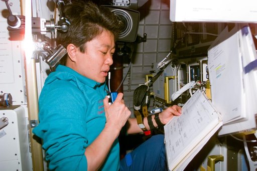 Mukai reviews checklist in the Spacehab module