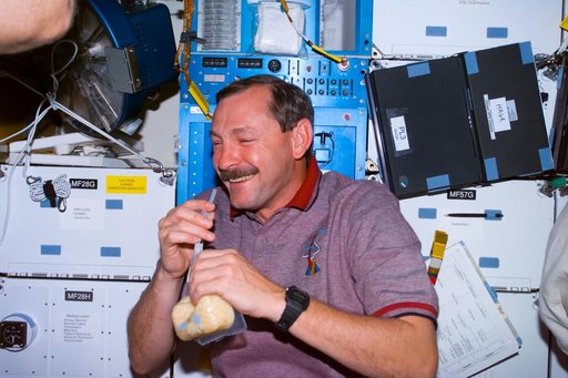 Brown on middeck with drink packet