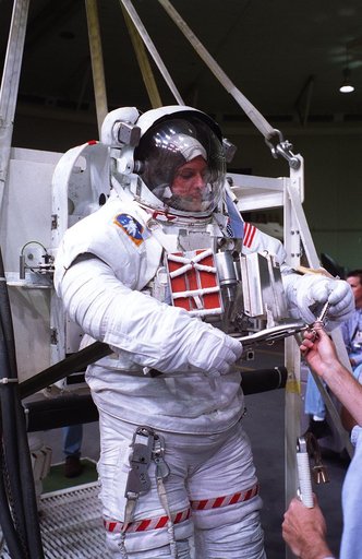 Astronauts Greg Harbaugh and Joe Tanner suit up for training in WETF