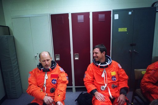 STS-82 Suit-up for Post Insertion Training in Crew Compartment Trainer 2