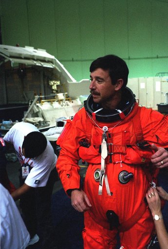 STS-82 Suit-up for Post Insertion Training in Crew Compartment Trainer 2