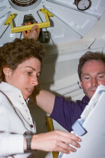 Ellen Ochoa and Valeri Tokarev prepare to open hatch from PMA2 into Node 1