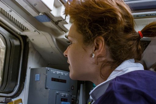 Tamara Jernigan looks out of aft flight deck windows after rendezvous with ISS