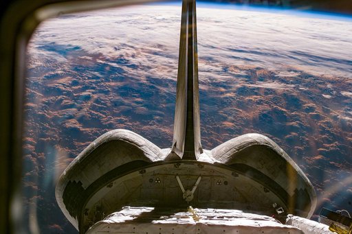 View of the Discovery payload bay from the aft flight deck windows