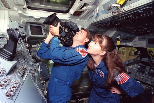 Astronauts Ashby and Coleman practice with High Definition Video Camera