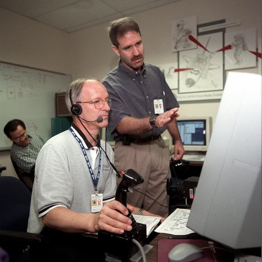 STS-103 crew perform virtual reality training in building 9N