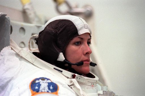 STS-99 crewmembers Kavandi and Thiel suit up in EMUs for NBL training