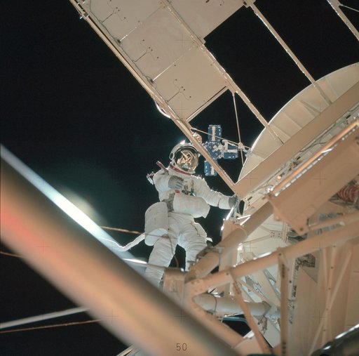 Astronaut Owen Garriott participates in EVA to deploy twin pole solar shield