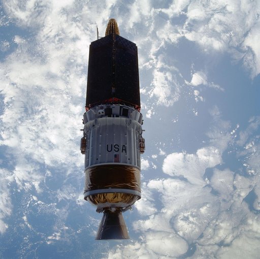 STS-43 TDRS-E & IUS over the Pacific Ocean after deployment from OV-104's PLB