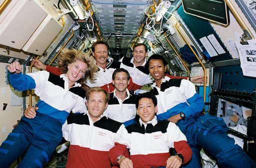 STS-47 crew poses for official onboard (in space) portrait in SLJ module