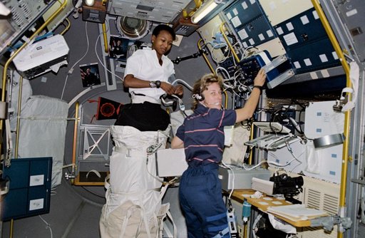 STS-47 MS Davis and MS Jemison conduct LBNP experiment in the SLJ module