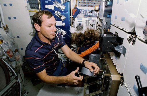 STS-47 MS Davis and Pilot Brown repair ISAIAH humidity problem aboard OV-105