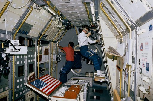 Crewmember working on the spacelab Zeolite Crystal Growth experiment.