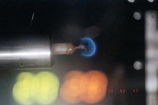 Candle Flames in Microgravity Experiment