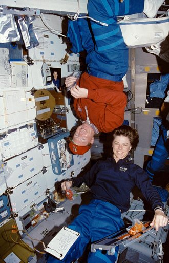 Crewmembers eating in the mid deck.