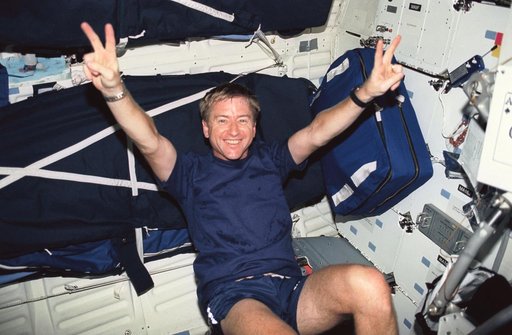 Astronaut Frank Culbertson on the ergometer in STS-51 Discovery's middeck