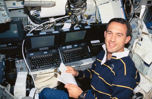 Astronaut James Newman works with computers and GPS