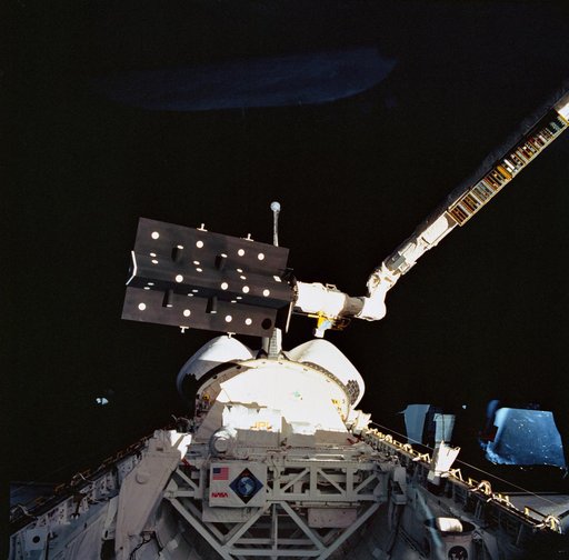 STS-52 CANEX-2 Canadian Target Assembly (CTA) held by RMS over OV-102's PLB