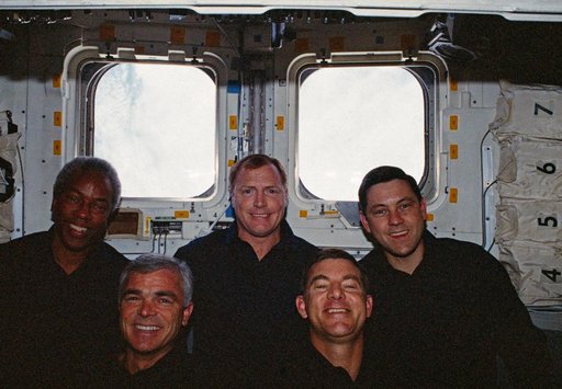 In orbit crew group portrait in the aft flight deck.