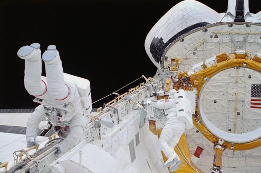 EVA Crewmembers working in the payload bay.
