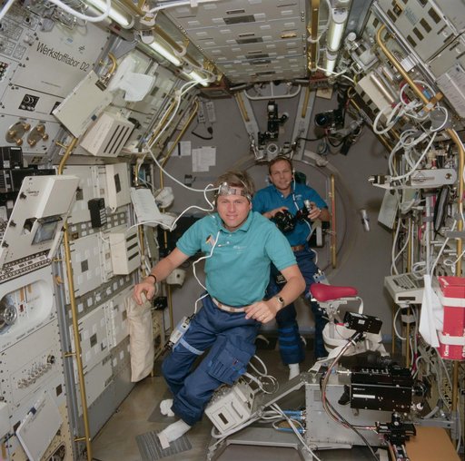 STS-55 German payload specialists Walter and Schlegel work in SL-D2 module