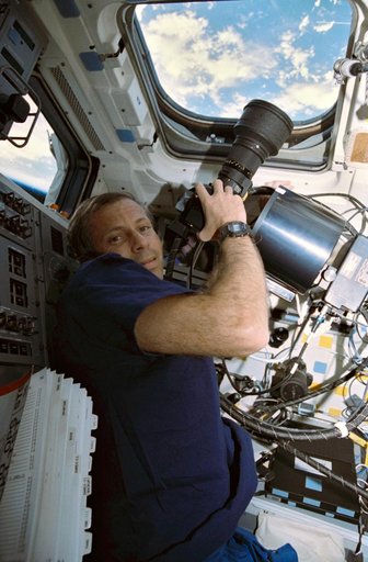 STS-56 MS2 Cockrell with HERCULES camera at overhead window W8 on OV-103's FD