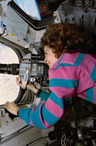STS-56 MS3 Ochoa points HASSELBLAD 70mm camera out OV-103's overhead window
