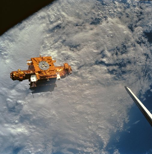 STS-56 view of freeflying SPARTAN-201 backdropped against heavy cloud cover