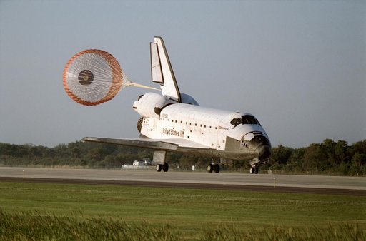 STS-56 Discovery, OV-103, with drag chute deployed lands on KSC SLF runway 33