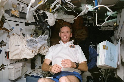 STS-57 Pilot Duffy checks out EMU equipment on the middeck of OV-105