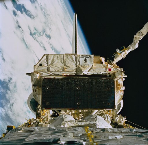STS-57 remote manipulator system (RMS) grapples EURECA over OV-105's PLB