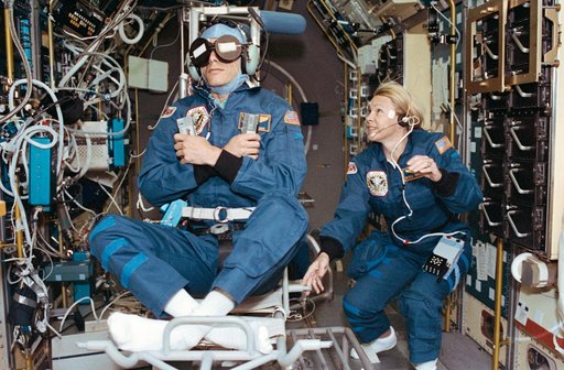 Crewmember in SPACELAB wearing the Acceleration Recording Unit and Collar.