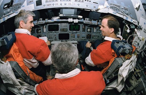 Fisheye view of flight deck and astronauts Gutierrez, Chilton and Clifford