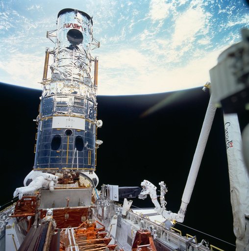 Astronaut Jeffrey Hoffman with WF/PC during third STS-61 EVA