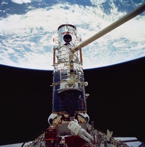 Astronaut Jeffrey Hoffman with WF/PC during third STS-61 EVA
