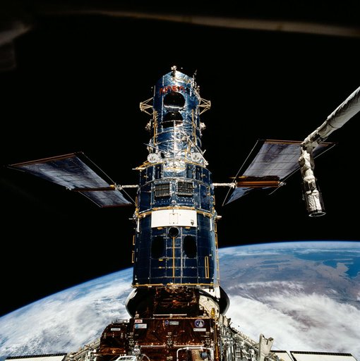 Hubble Space Telescope is berthed in Endeavour's payload bay after capture