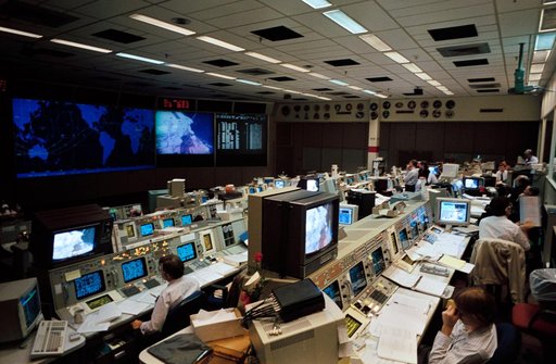 Flight controller Kevin McCluney monitors STS-61 astronauts during EVA