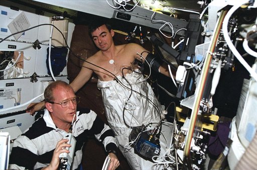 Astronauts Gemar and Allen work with lower body negative pressure experiment