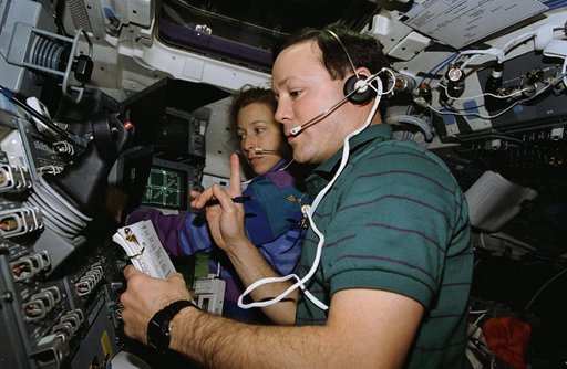 Astronauts Thuot and Ivins work with the Dexterous End Effector (DEE)